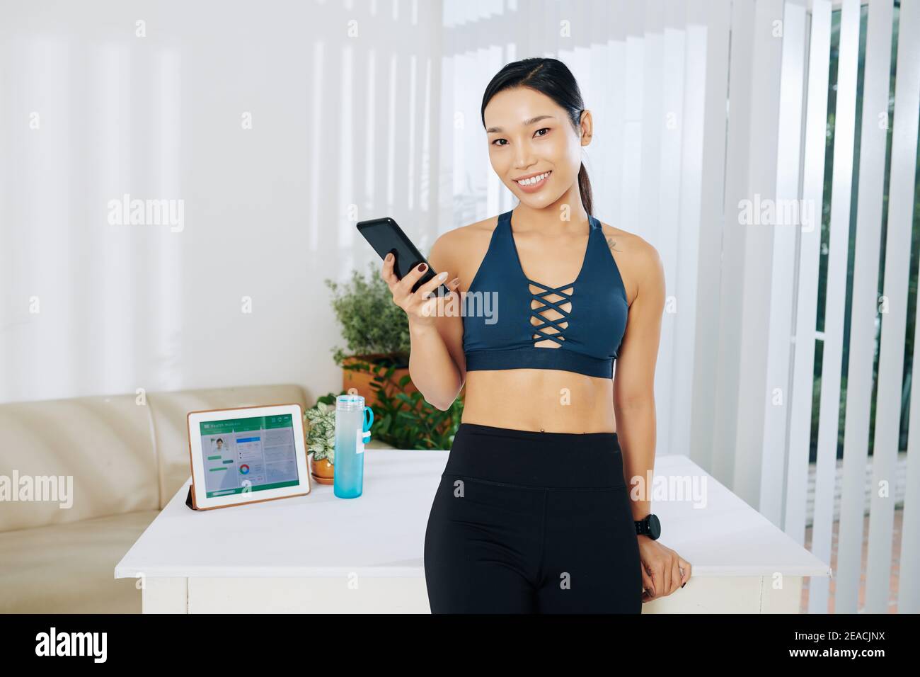 Beautiful young fit Asian woman Stock Photo