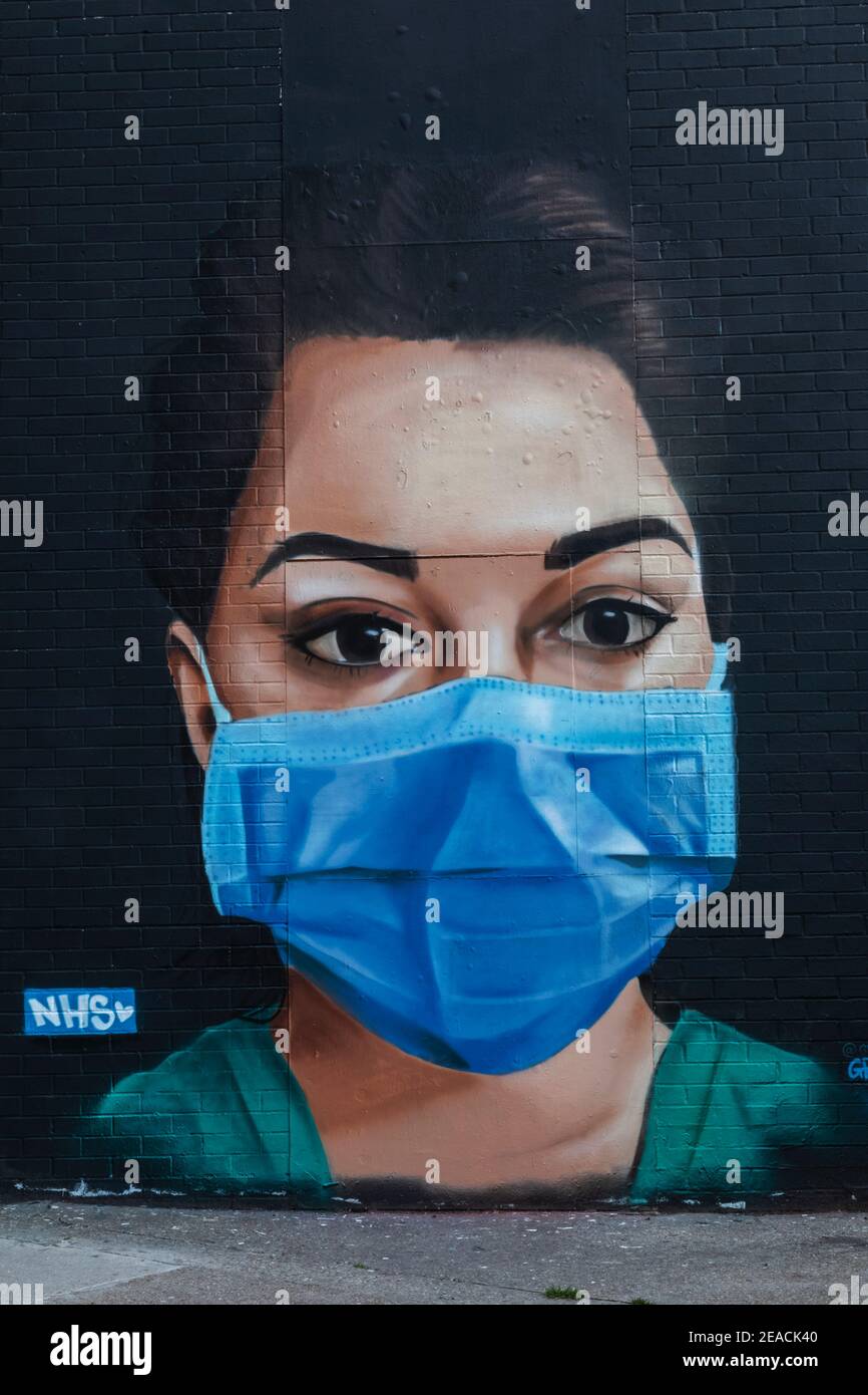 England, London, Wall Art depicting Nurse Wearing Face Mask Stock Photo