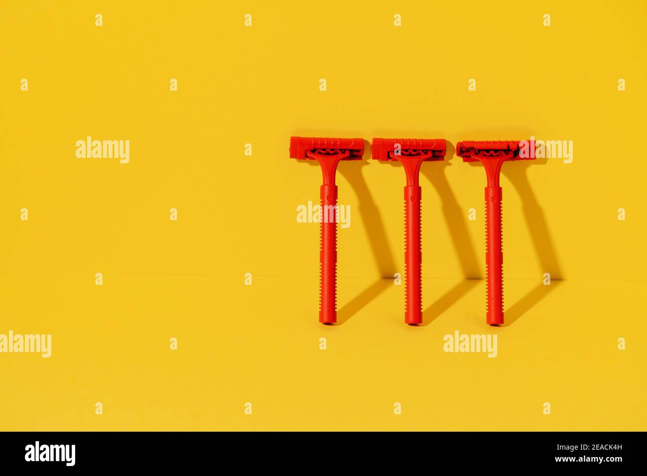 Disposable razors on yellow background, studio shot Stock Photo - Alamy
