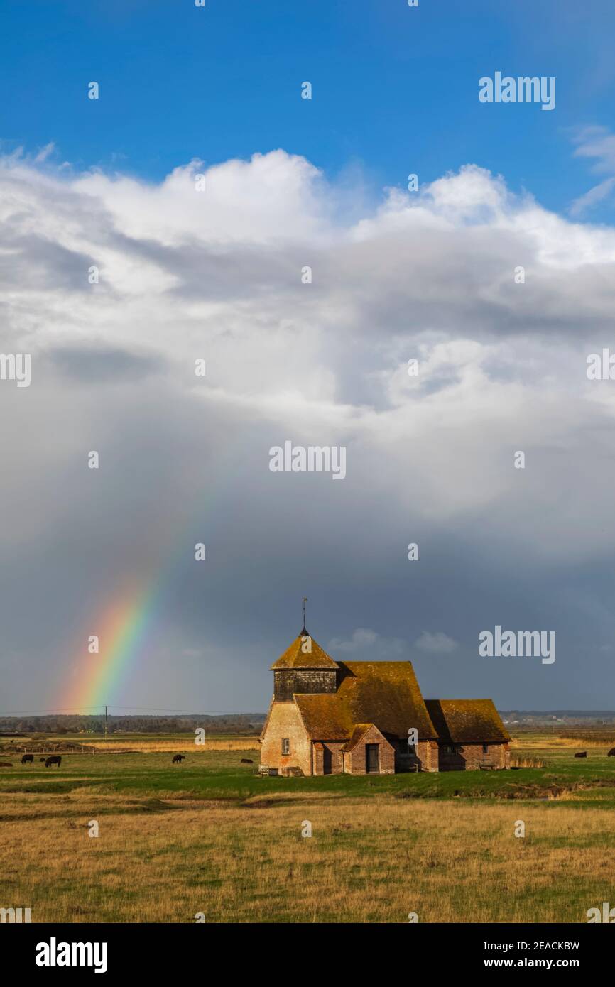 England, Kent, Romney Marsh, Fairfield, St. Thomas Becket Church and Rainbow Stock Photo