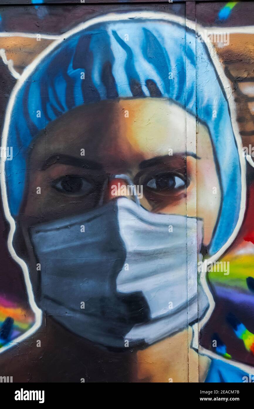 England, London, Wall Art depicting Nurse Wearing Face Mask Stock Photo