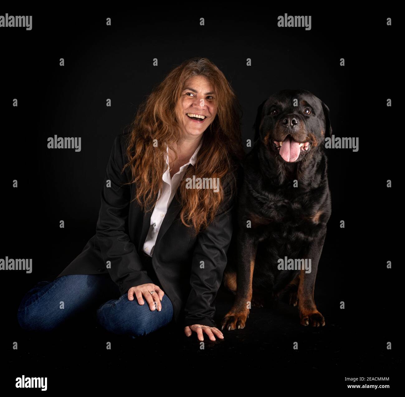 Three Rottweilers Woman purebred rottweiler and woman in front of black background Stock Photo ...