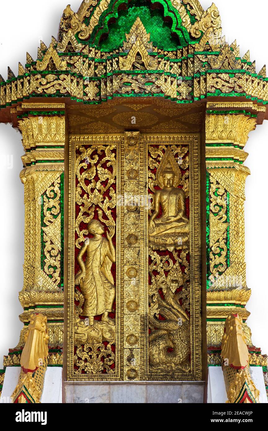 Door with gilded carvings illustrating mythological creatures and scenes from the life of the Buddha, Haw Pha Bang Temple, Luang Prabang, Laos Stock Photo