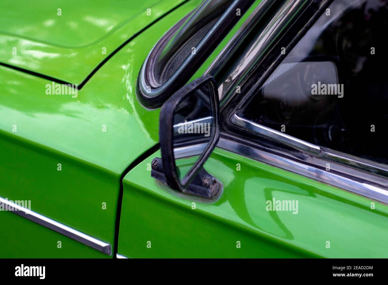 Outdoor mirror of old Soviet car. Side view. View from the front. The body is green. Kurskoe, Crimea - 4 October, 2020 Stock Photo