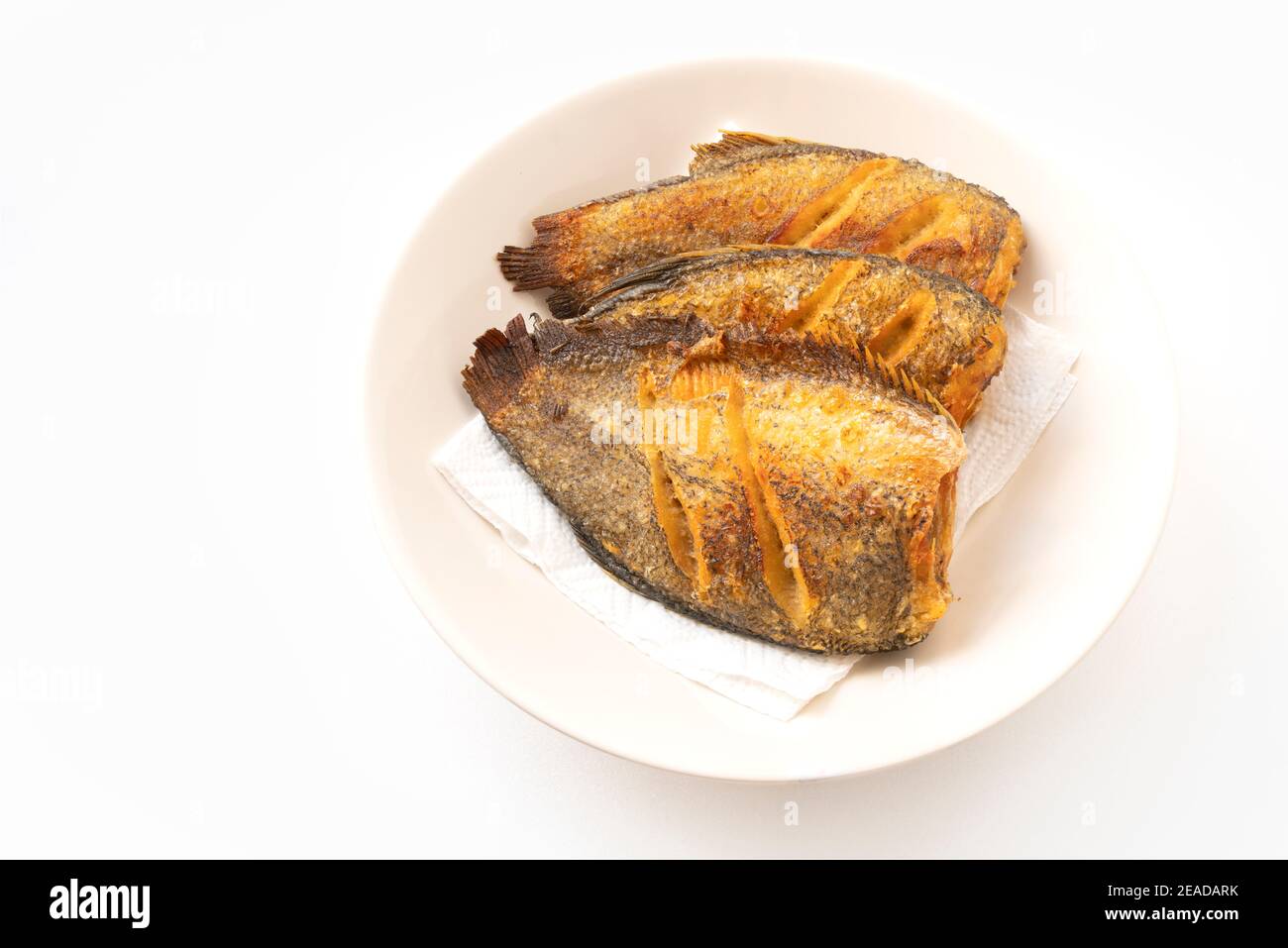 Deepfried fishes or Snakeskin gourami fish in the round disk on white