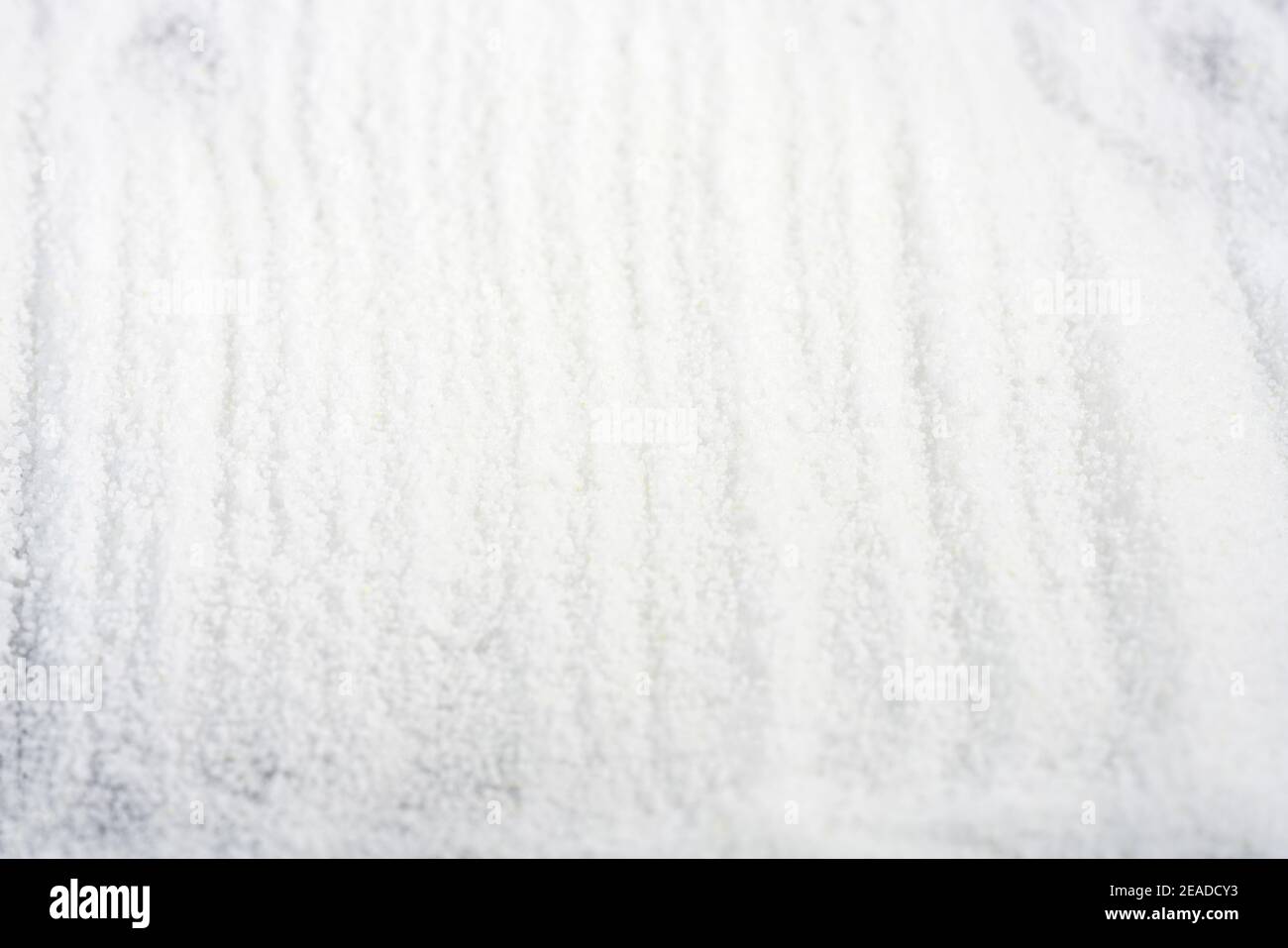 Makrogol powder photographed against a black background in the studio Stock Photo