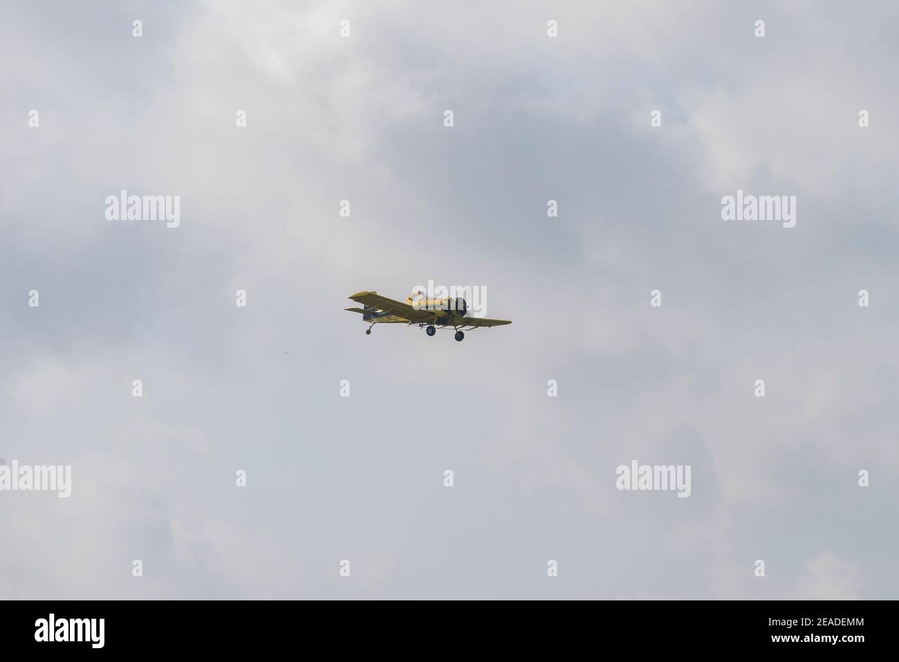 Airplane flying against cloudy sky Stock Photo - Alamy