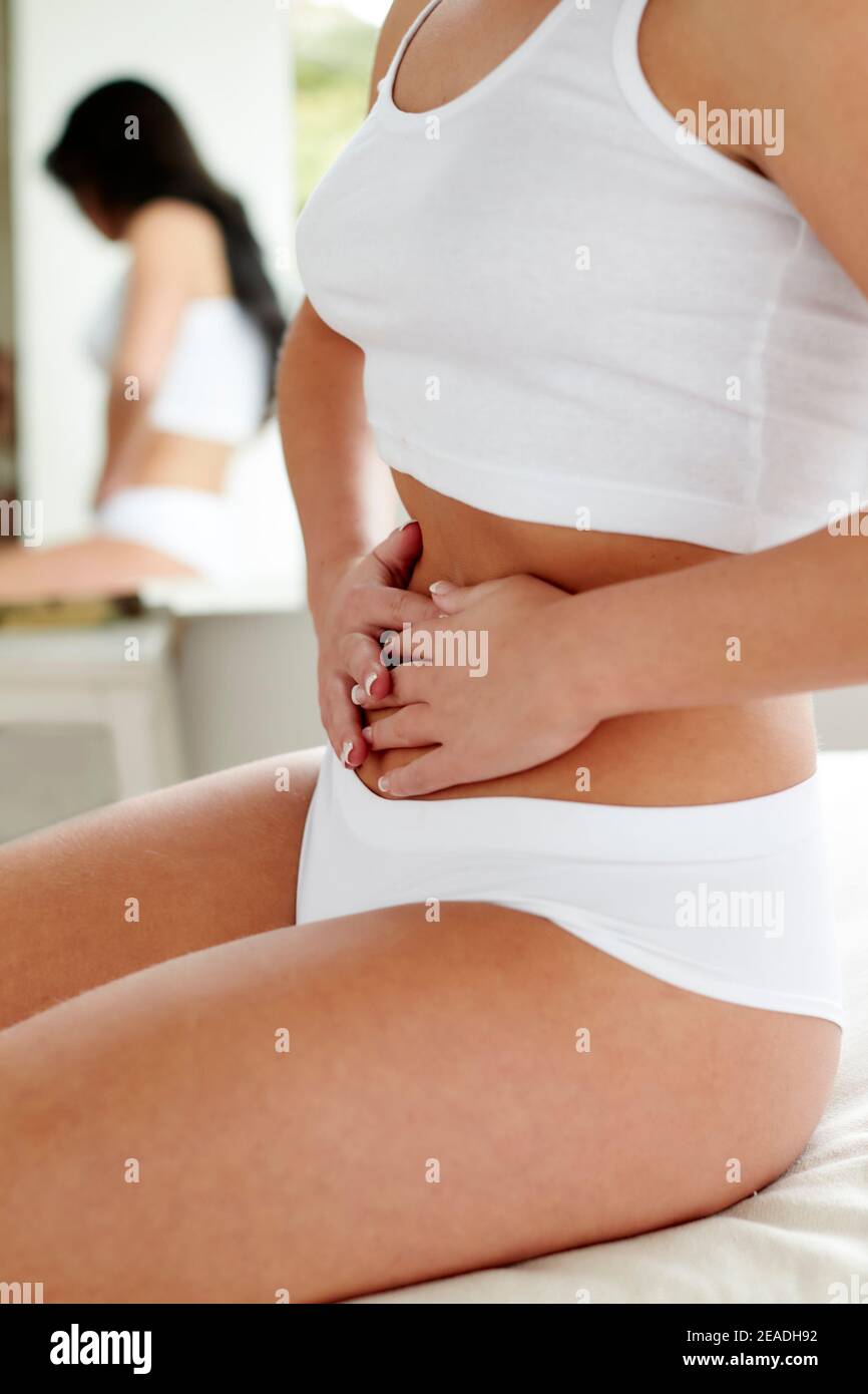 Woman with stomach pains Stock Photo