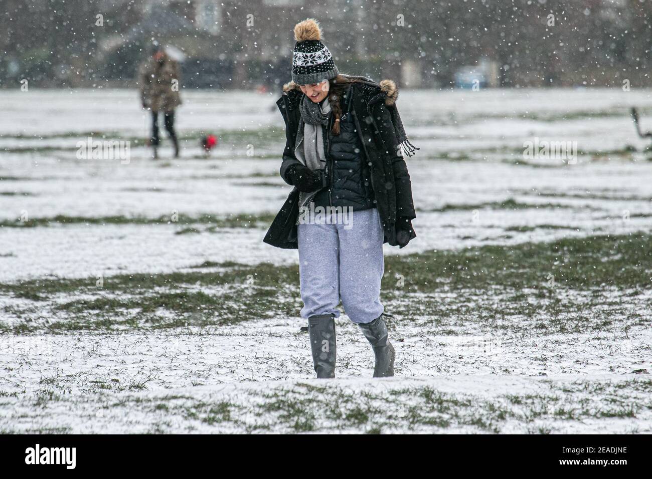 Wimbledon London Uk 9 February 21 A Woman Walks During A Snow Shower This Morning On Wimbledon Common From The Effects Of Storm Darcy The Met Office Has Issued Yellow Snow And Ice Wimbledon London Uk 9 February 21 A Woman Walks During A Snow Shower This Morning On Wimbledon Common From The Effects Of Storm Darcy The Met Office Has Issued Yellow Snow And Ice