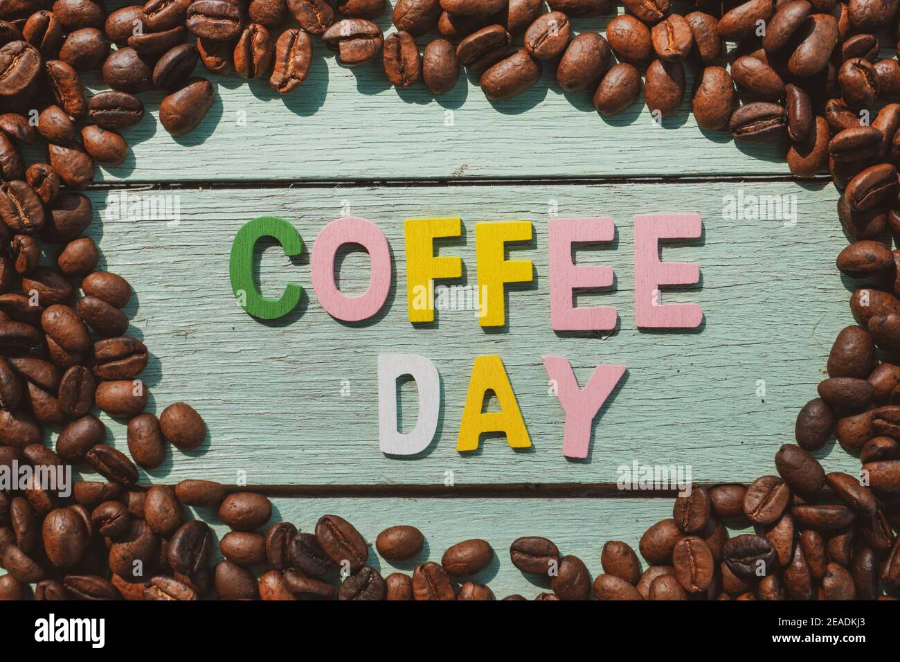 coffee-day-alphabets-form-on-roasted-coffee-beans-background-stock
