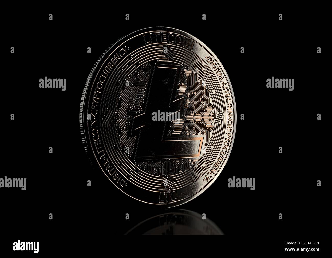 A dimly lit physical litecoin cryptocurrency in bronze and silver coin form  on a dark studio background- 3D render Stock Photo - Alamy