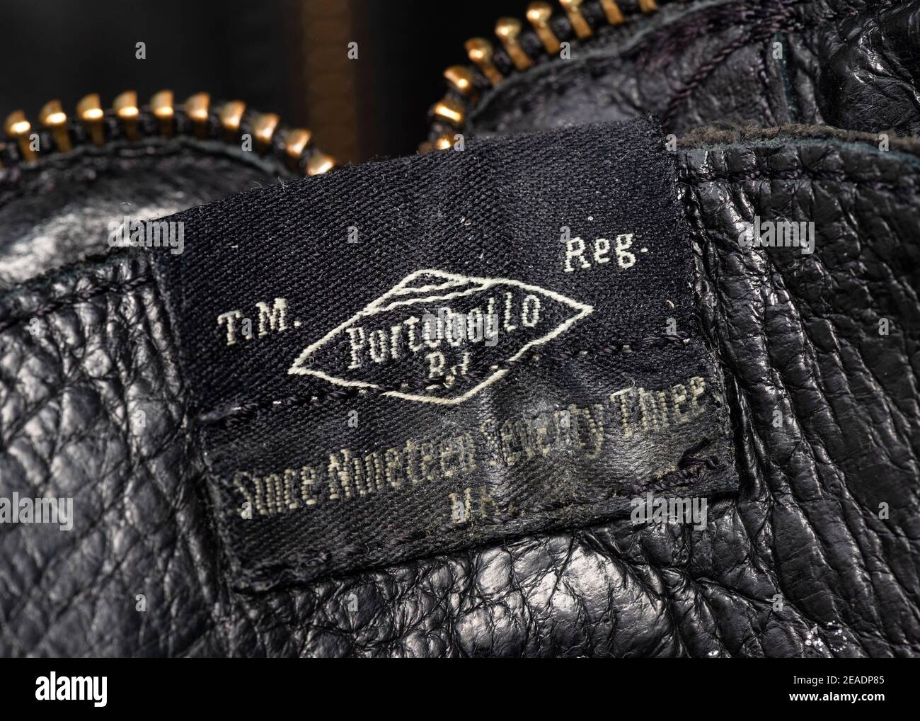 Portobello Rd. vintage worn out label on Pepe Jeans black leather men's boots close up detail Stock Photo