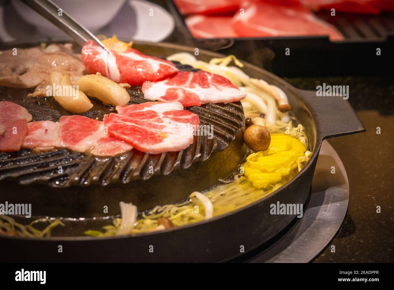 Korean Barbecue (BBQ) Table with Grill and Sides Stock Photo - Alamy