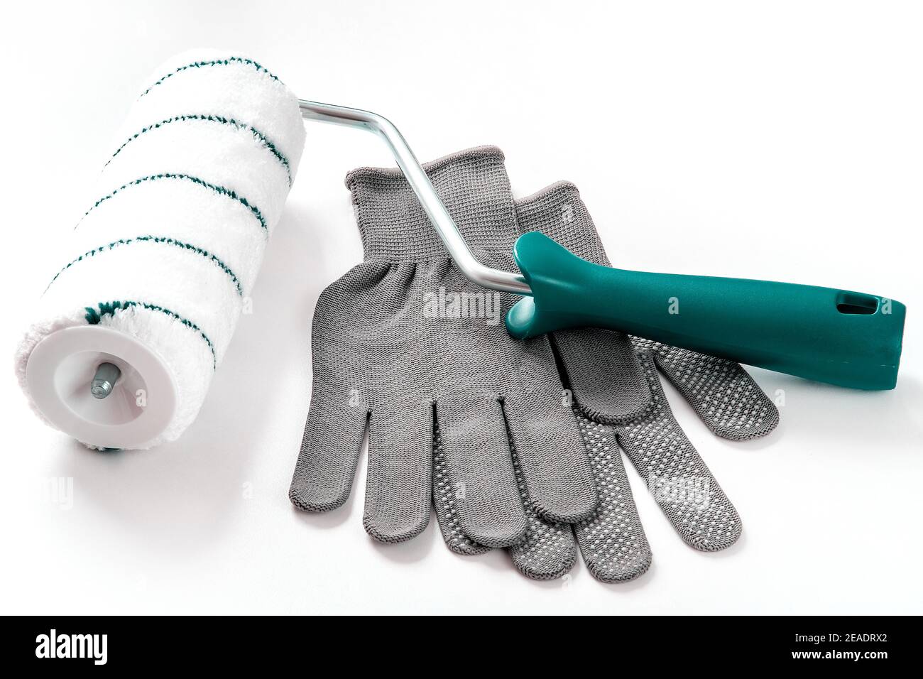 Paint roller, protective gloves, everything for repair and painting Stock Photo