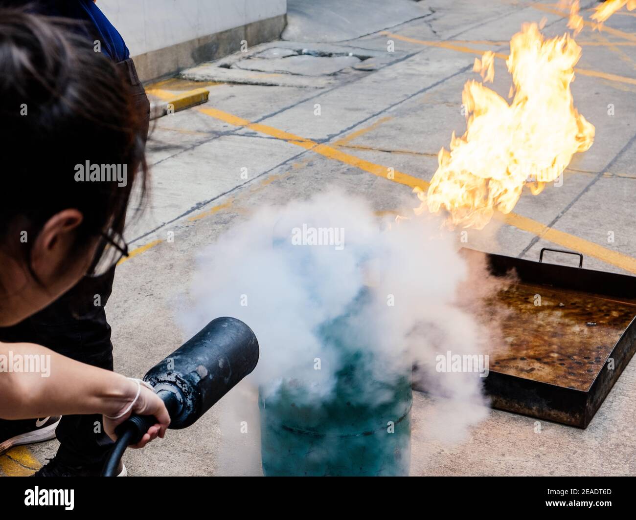 Employees firefighting training,Extinguish a fire. Stock Photo