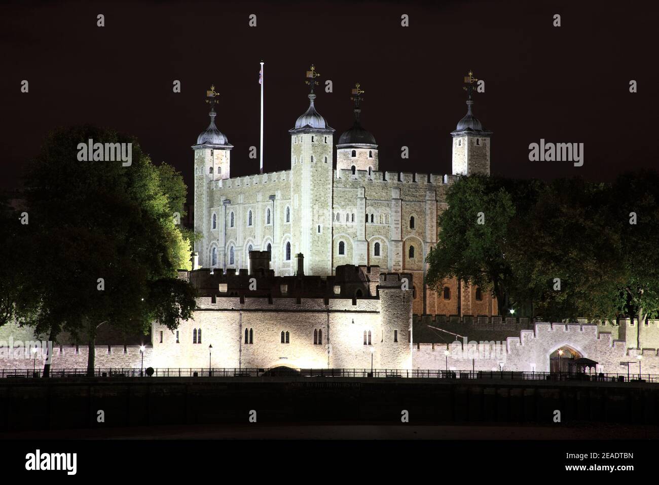 Tower of London at night which is an 11th century Norman castle fortress on the River Thames and is a popular tourist travel destination attraction la Stock Photo