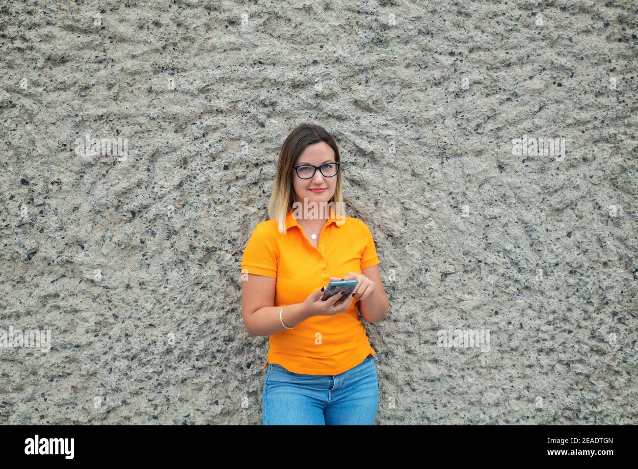 Person wearing orange shirt hi-res stock photography and images - Alamy