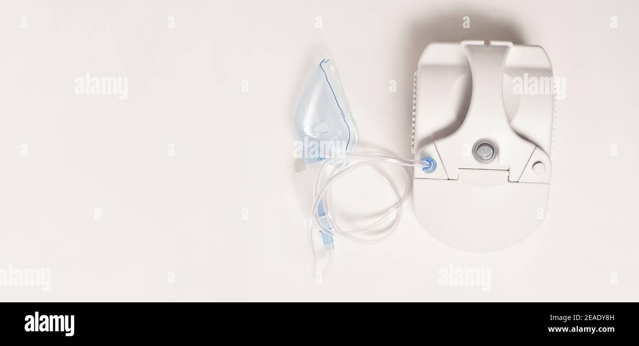 White compressor inhaler with mask on white background, stock photo Stock Photo