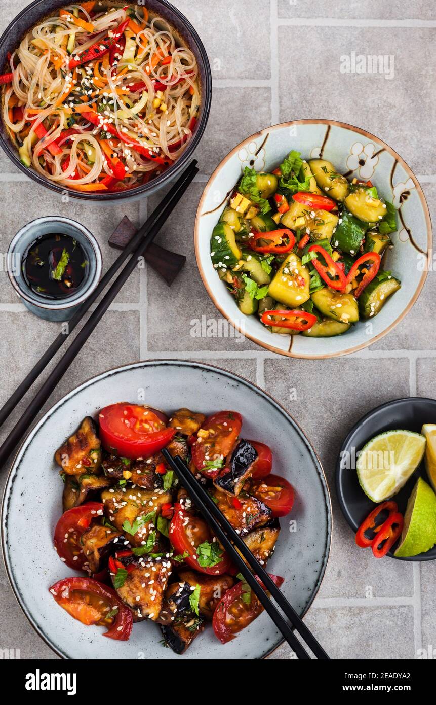 Asian food. Eggplant stirfry, broken cucumbers, rice glass noodles