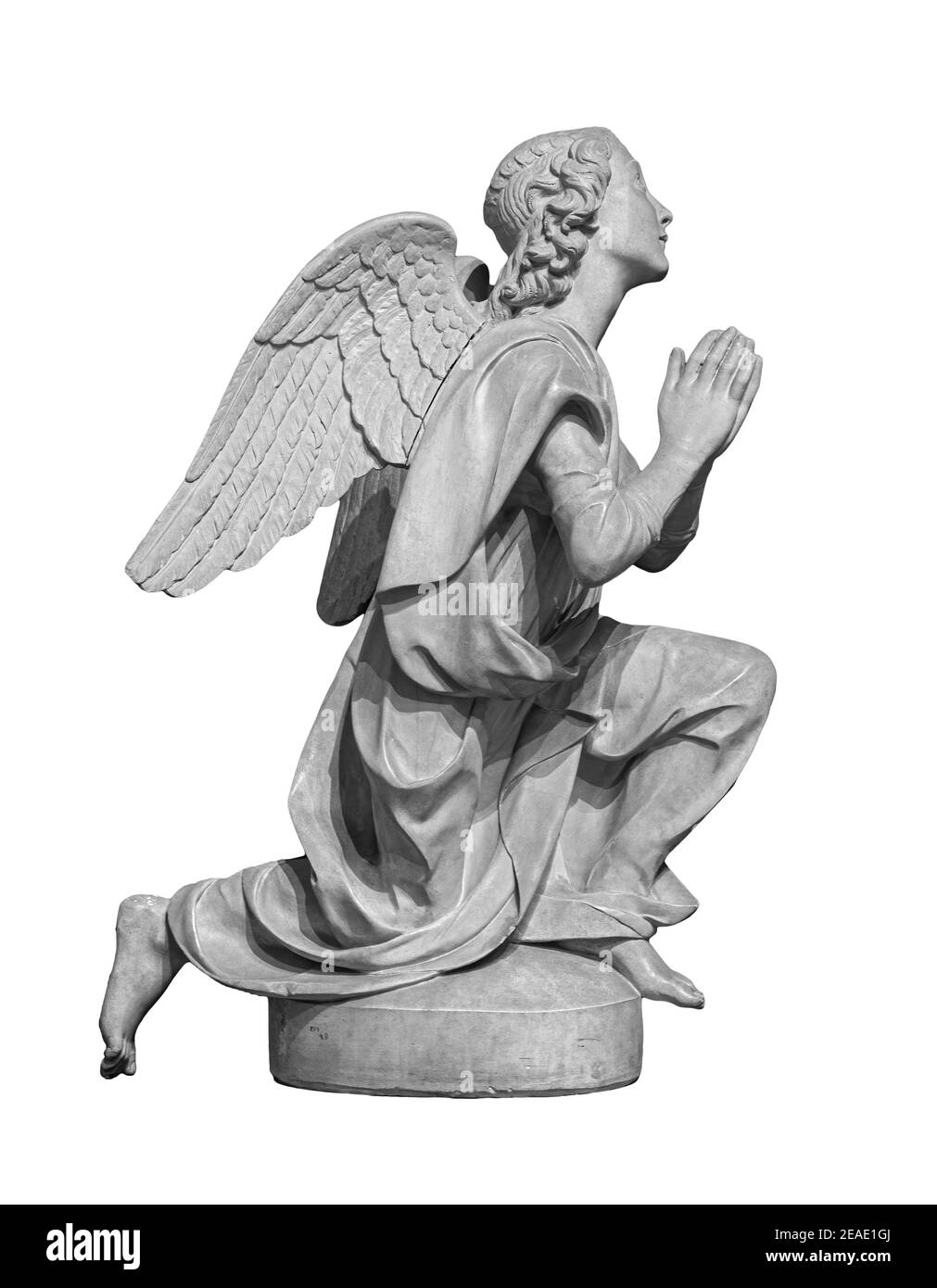 Angel statue isolated on white background. White stone sculpture of praying cherub Stock Photo
