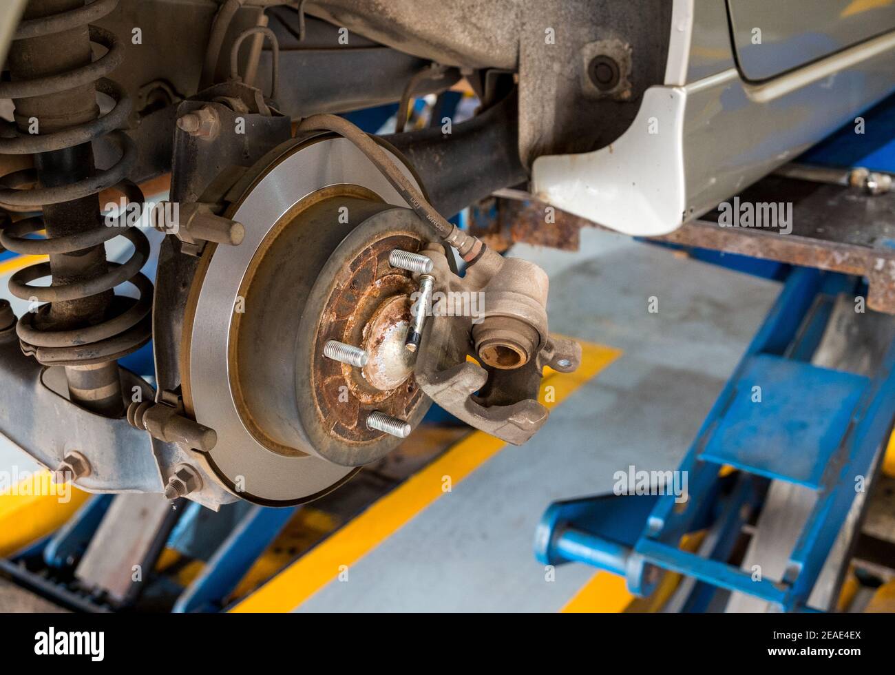 Disc brake of the car during the maintenance at auto service,closeup
