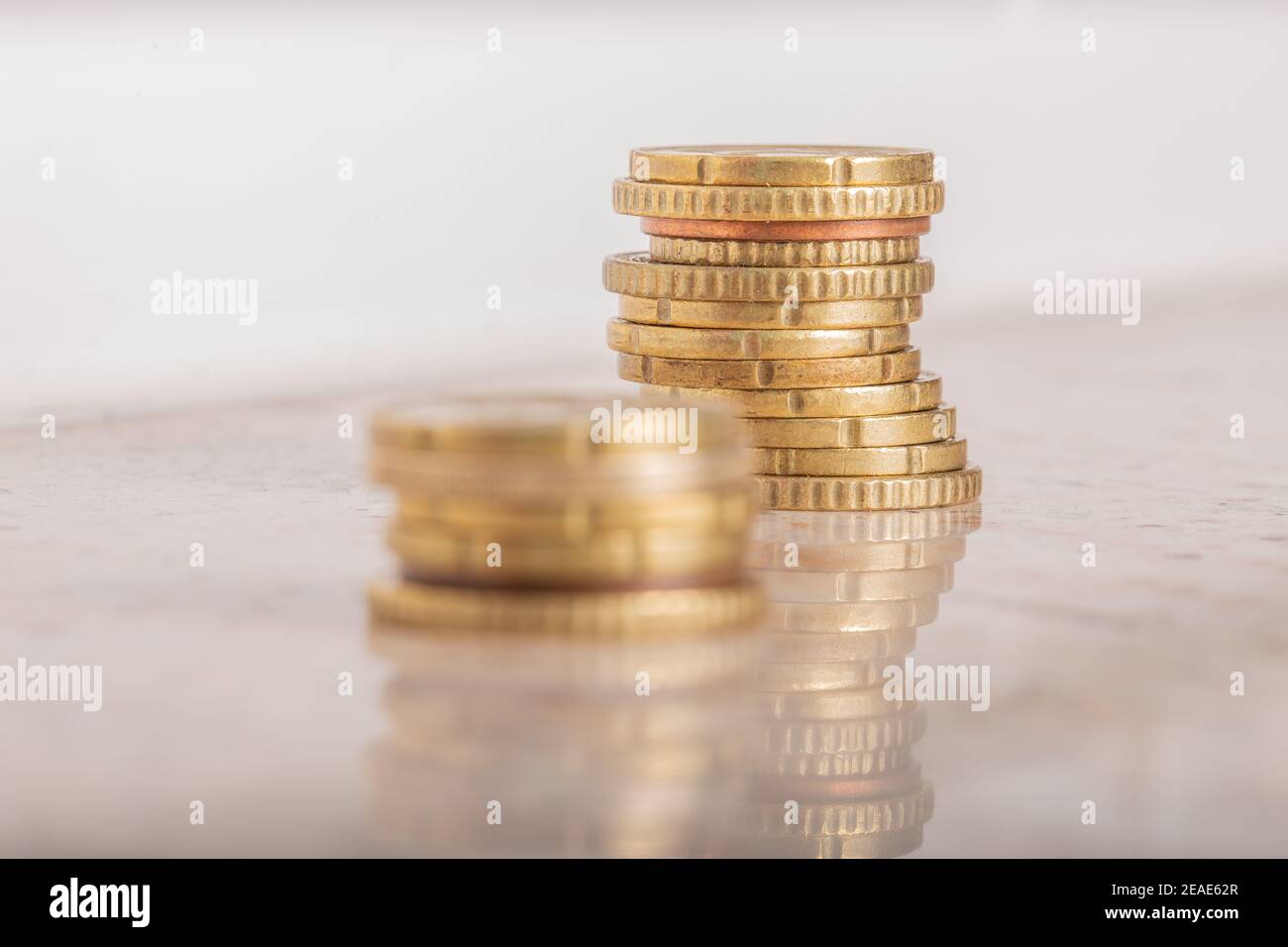 Gold coins cash money in piles, Isolated on white background Stock ...