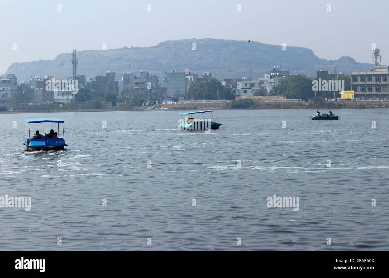 People enjoying boating in Bhalswa Horseshoe Lake in Delhi India Stock