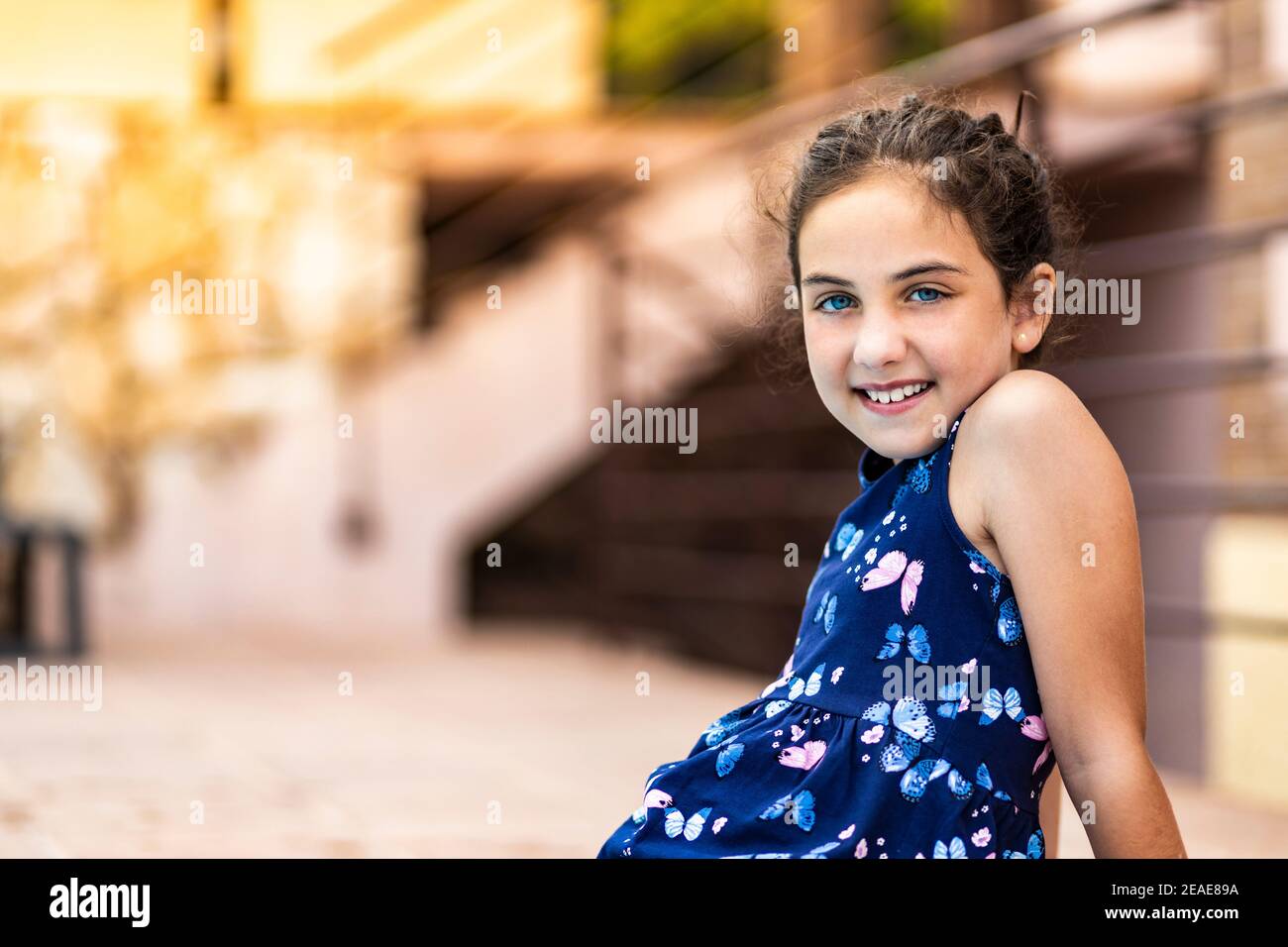 Beautiful little girl with blue dress Stock Photo - Alamy