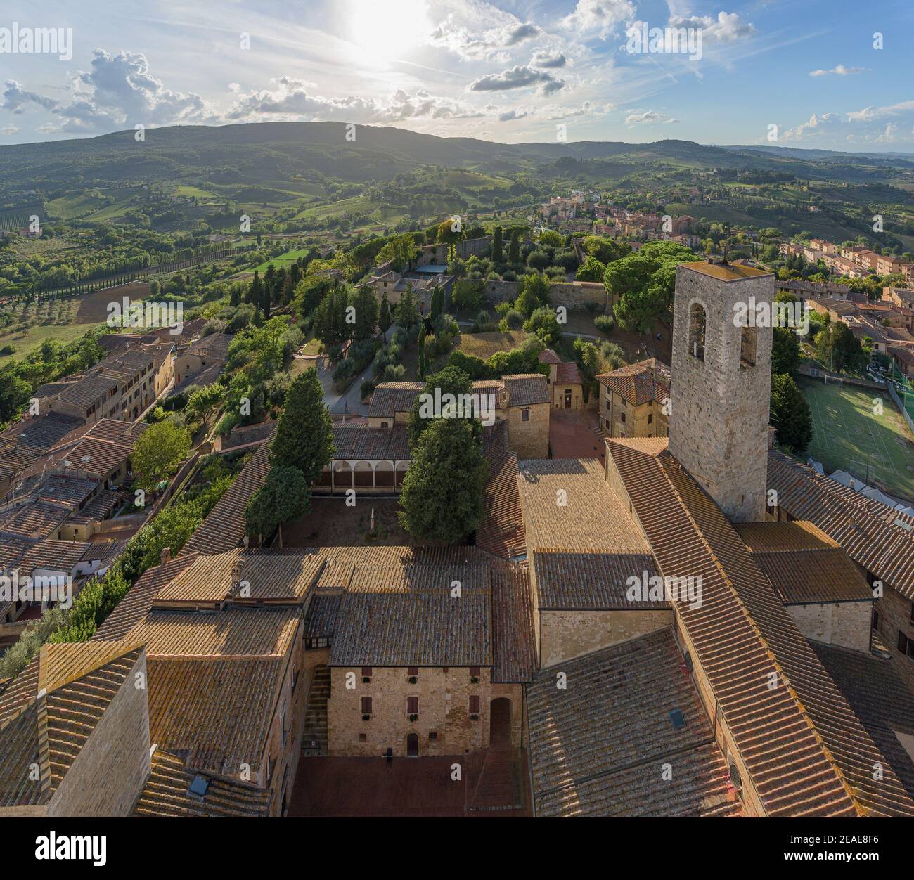 Typical landscape with rolling hills and vineyards around San Gimignano town, a landmark in the wine region famous for its many stone towers and churc Stock Photo