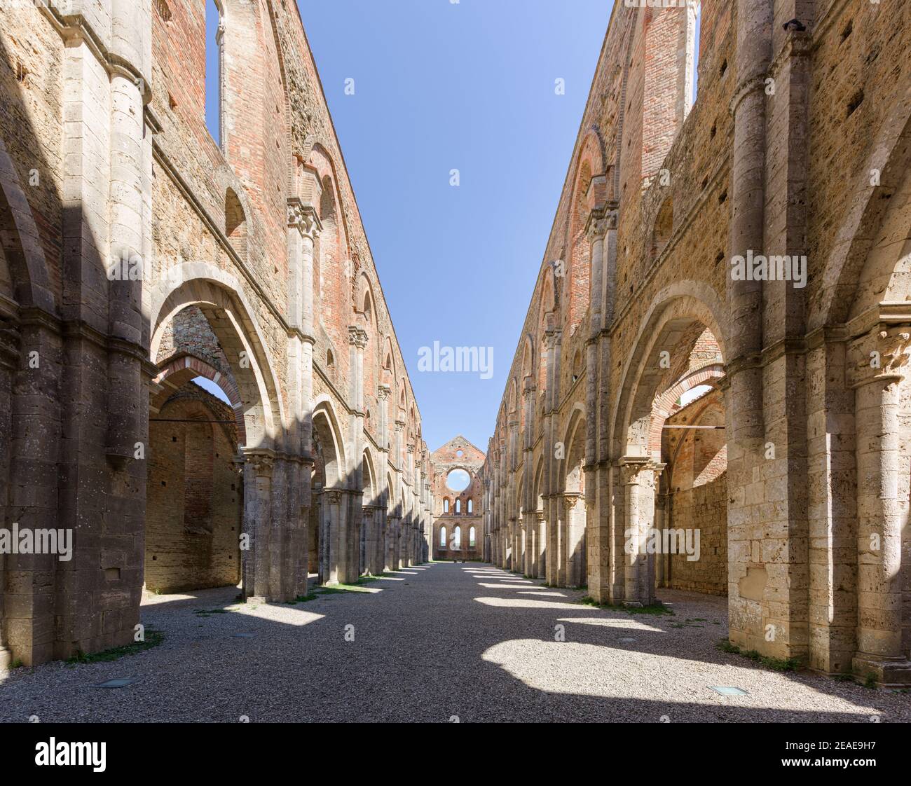 Perspective of the central nave of abandoned San Galgano Abbey, a Cistercian monastery from the Middle Ages built in Chiusdino, a Tuscany countryside Stock Photo