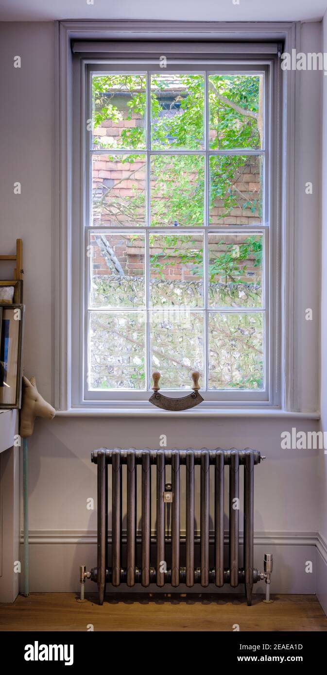 Inside of a traditional sash window in a modern contemporary home in Sussex, UK. Stock Photo