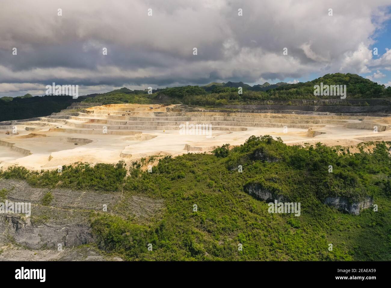 Open pit limestone quarry in the mountains of Bohol Island, Philippines