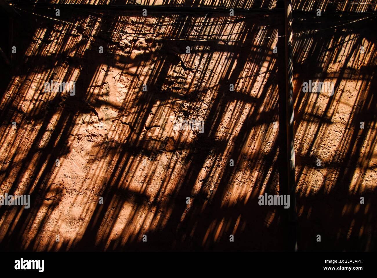 Marrakesh Souk with shafts of light. Abstract reflections of bamboo sunshade over passageway in the Medina. Marrakesh. Morocco, Stock Photo