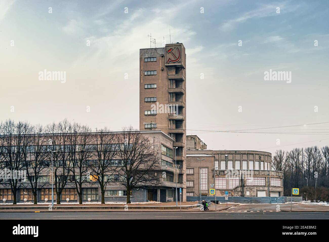 Kirovsky District Council, a monument of the constructivist era in St. Petersburg. Hammer and Sickle on the tower. Stock Photo