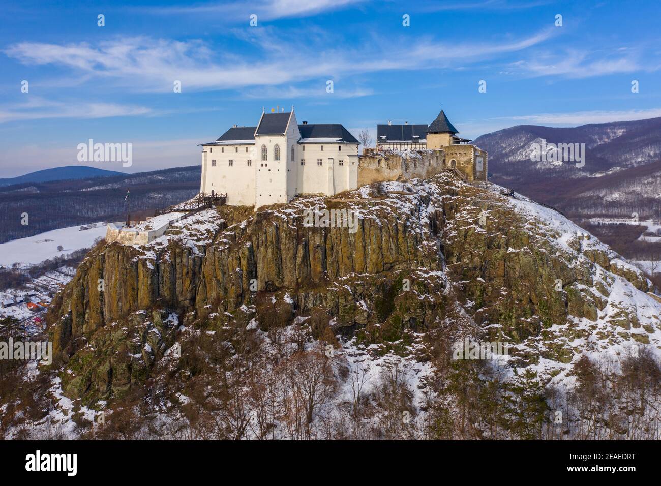 Füzér, Hungary - Aerial view of the famous castle of Fuzer built on a volcanic hill named Nagy-Milic. Zemplen mountains at the background. Stock Photo