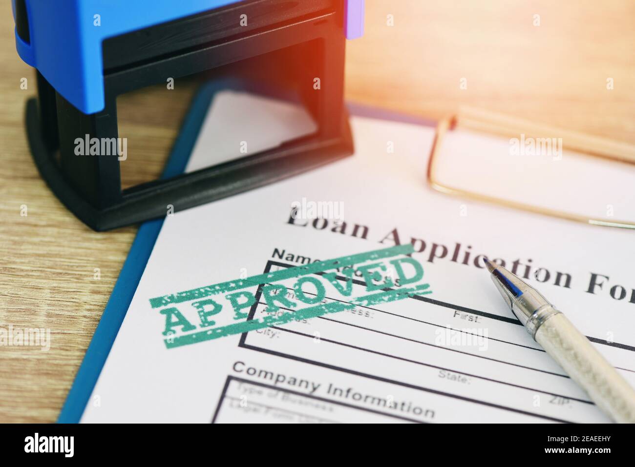 Loan approval, Loan application form with Rubber stamping that says Loan Approved, Financial loan money contract agreement company credit or person Stock Photo