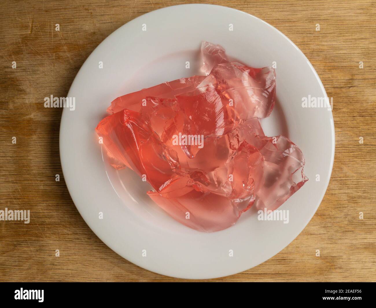 Top view on white plate full of strawberry jelly Stock Photo
