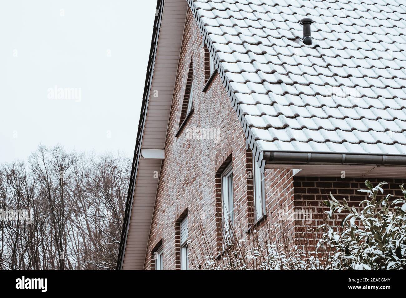 Roof of a house covered by sn Stock Photo - Alamy