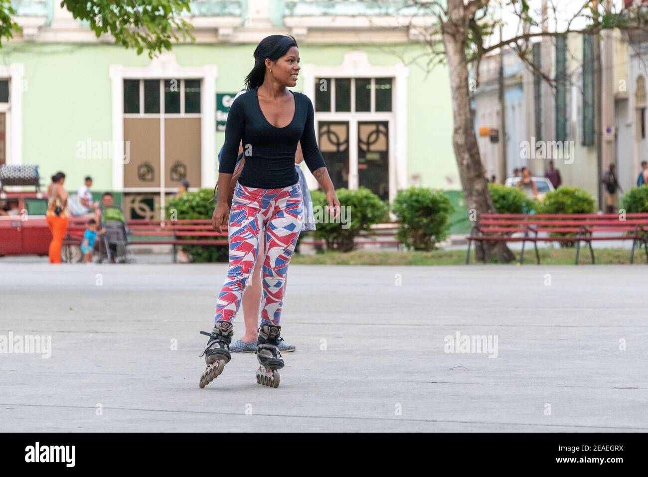 Young Afro Caribbean woman skating in Santa Clara, Cuba Stock Photo