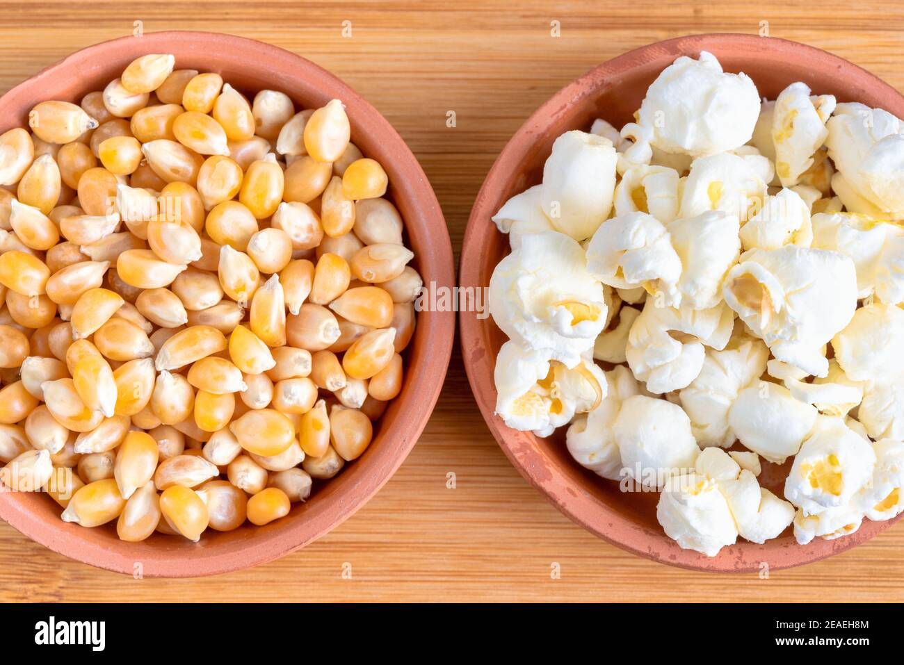 Comparison of popped and unpopped popcorn Stock Photo Alamy