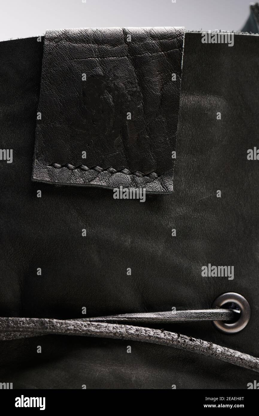 Black leather empty label on textile surface close up view Stock Photo