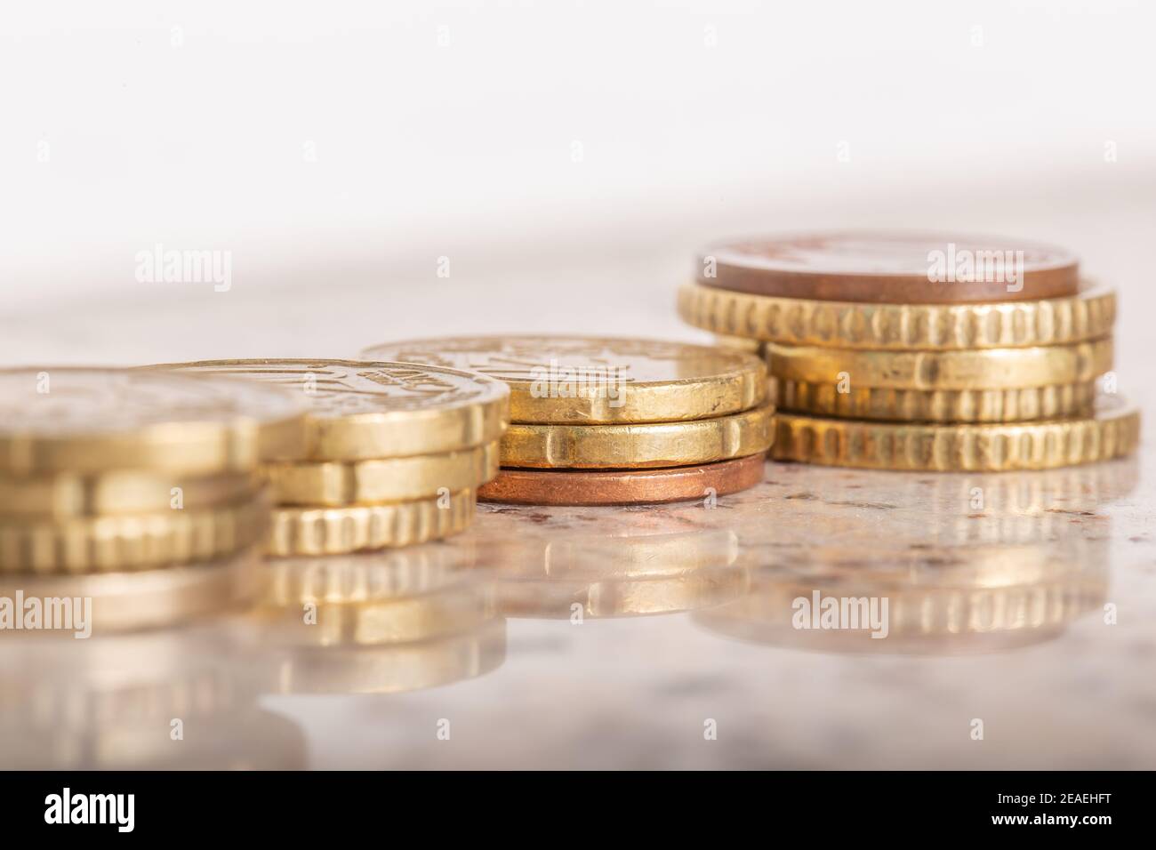 Gold coins cash money in piles, Isolated on white background Stock ...