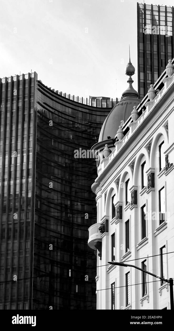 Vertical grayscale shot of modern buildings under a clear sky Stock ...