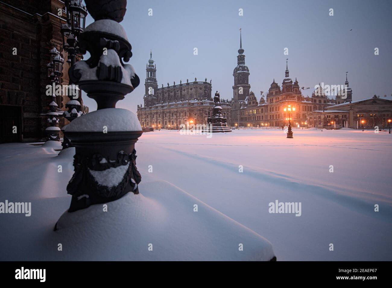 Dresden, Germany. 08th Feb, 2021. Snow-covered is the Theaterplatz in front of the Semperoper (l-r), the Hofkirche, the equestrian statue of King Johann, the Hausmannsturm, the Residenzschloss and the Schinkelwache in the morning. Credit: Robert Michael/dpa-Zentralbild/ZB/dpa/Alamy Live News Credit: dpa picture alliance/Alamy Live News Stock Photo