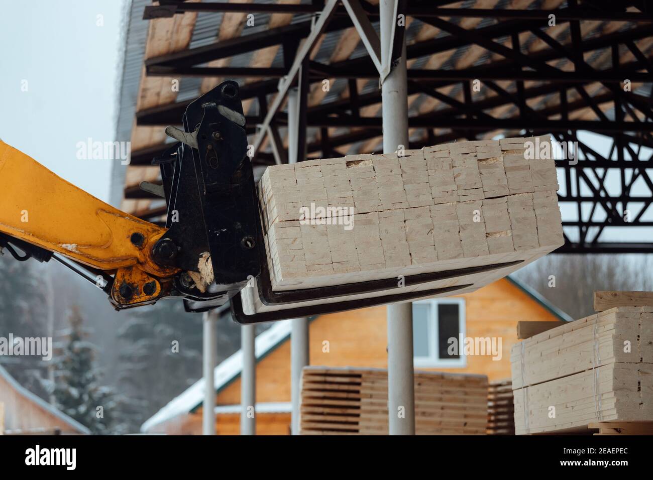 forklift truck with planks, delivery of wood to the warehouse, loading