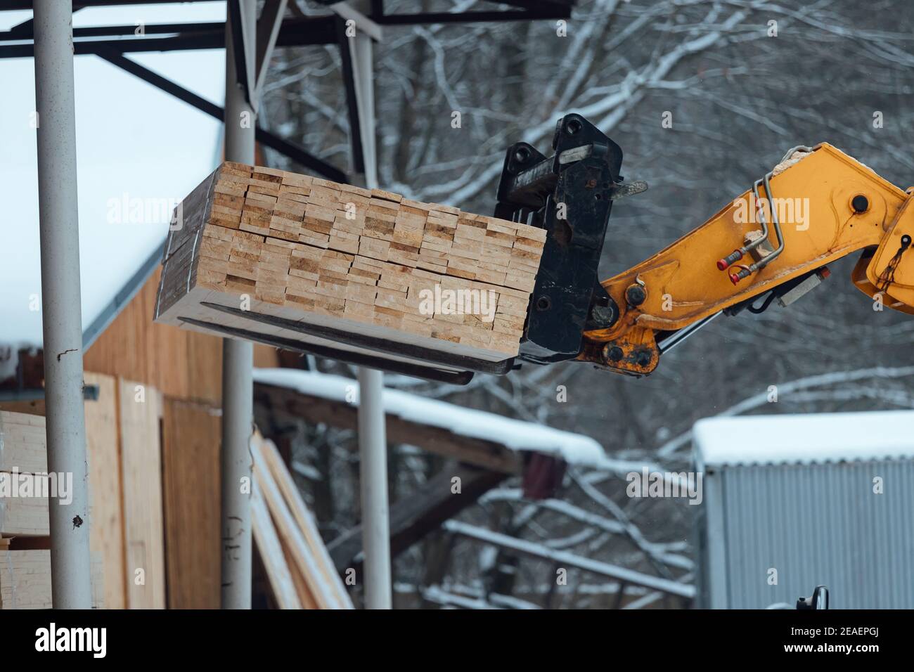 forklift truck with planks, delivery of wood to the warehouse, loading