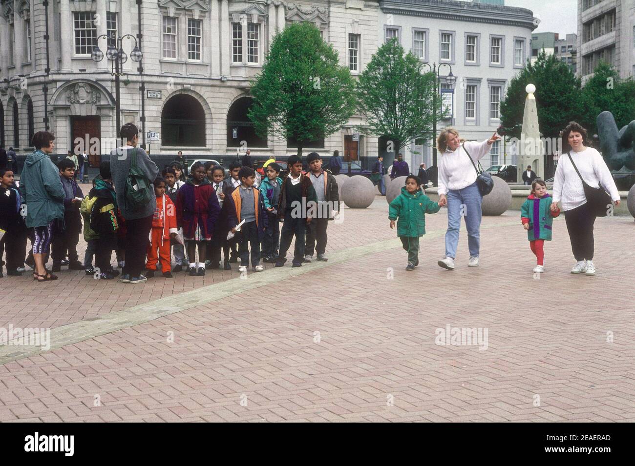 A lunchtime anthology of images taken in an hour on the 10 September 1993 records shoppers, office workers, city officials, parents and children, teachers and pupils going about their business with a background of the UK Midlands city of Birmingham. Stock Photo