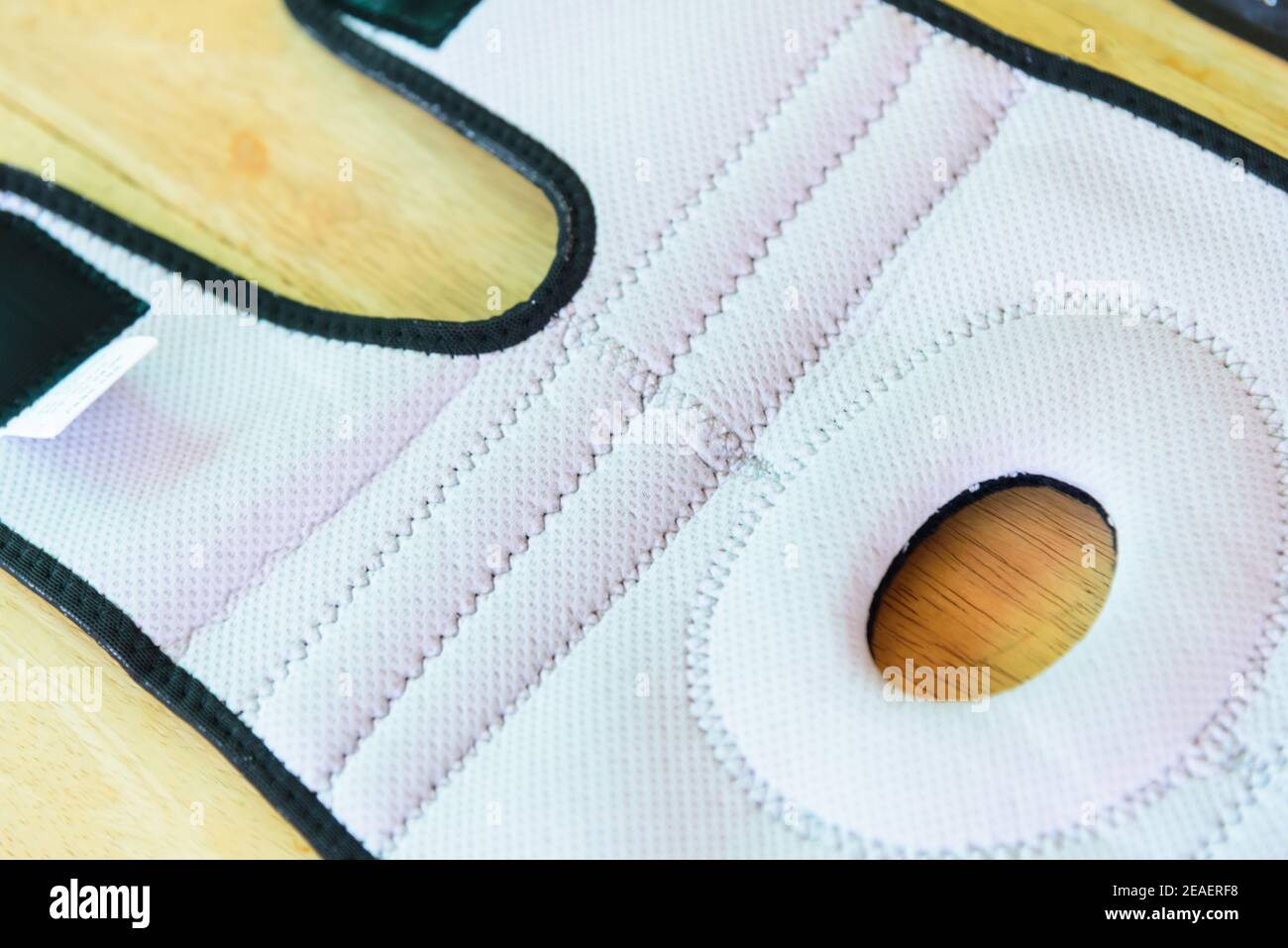 Knee Support Brace Patella with sunlight in the park / Knee Pads Hole Sports Stock Photo