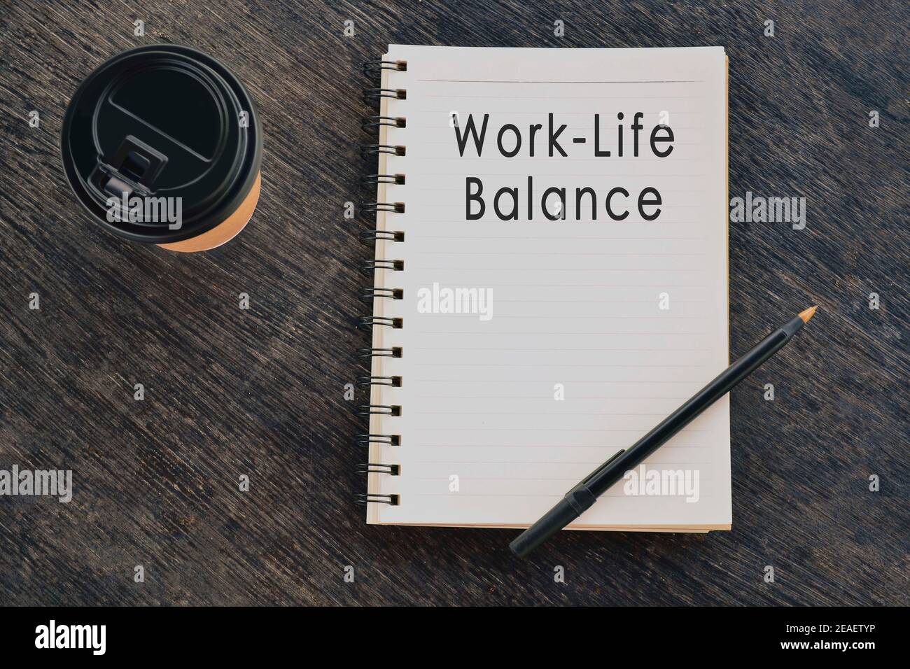 Work life balance text on notepad with disposable coffee cup and pen on ...