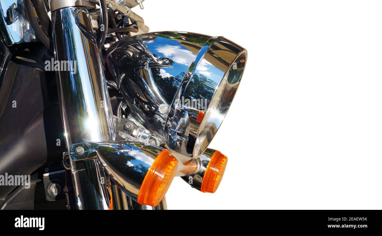 Close-up on the front of the motorcycle: reflector and blinkers. Stock Photo